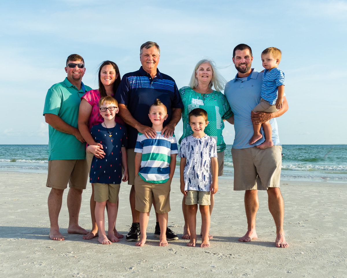 A large family poses on Siesta Key Beach