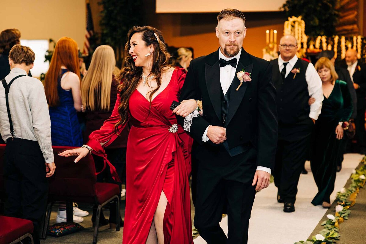 Guests in formal attire leaving church after wedding ceremony