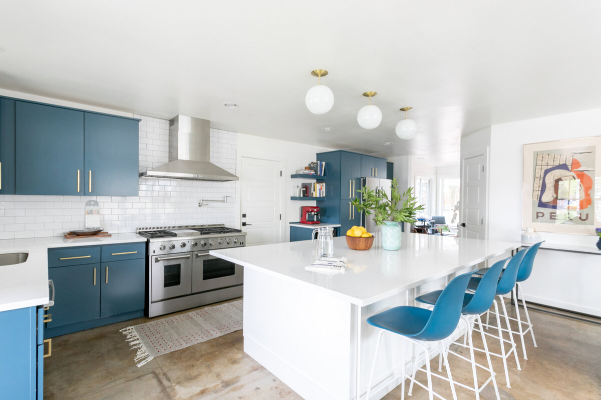 hello-home-austin-teal-kitchen-remodel-open-layout-semi-flush-pendants-l-shape-kitchen-stained-concrete-floors-4