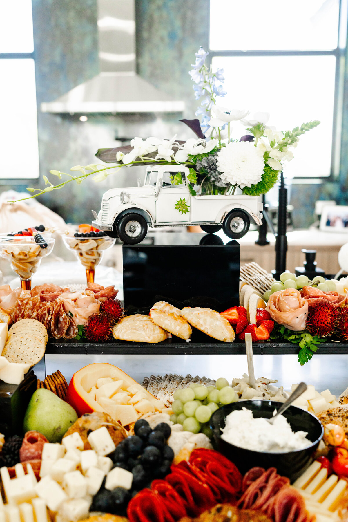 charcuterie spread with vintage truck