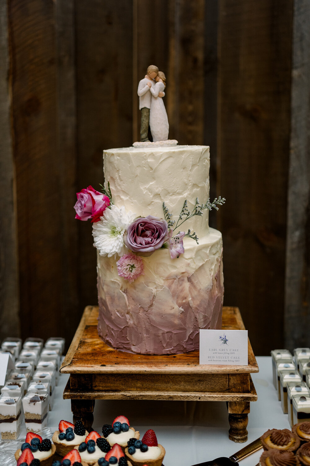 Two-tier watercolor wedding cake in shades of purple and white for a Montana summer wedding.
