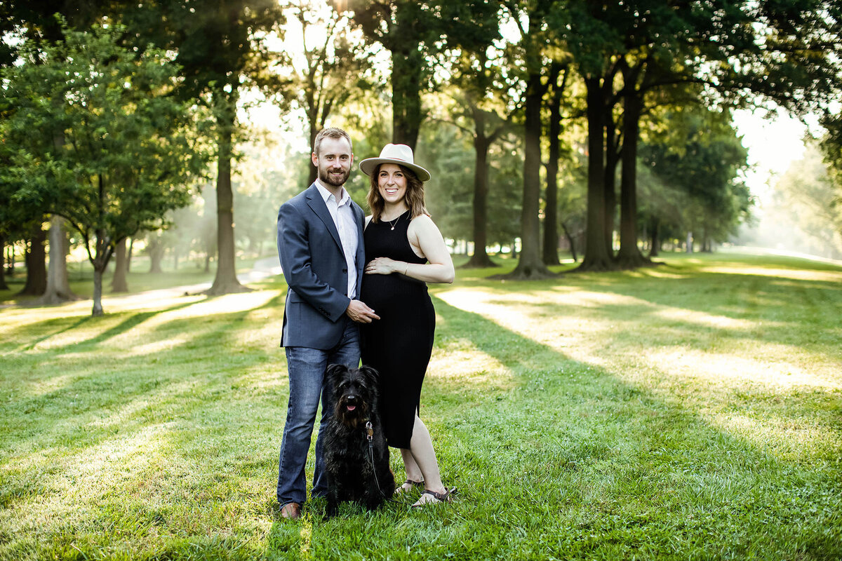 pregnant couple and their dog at outdoor northern virginia maternity photography session