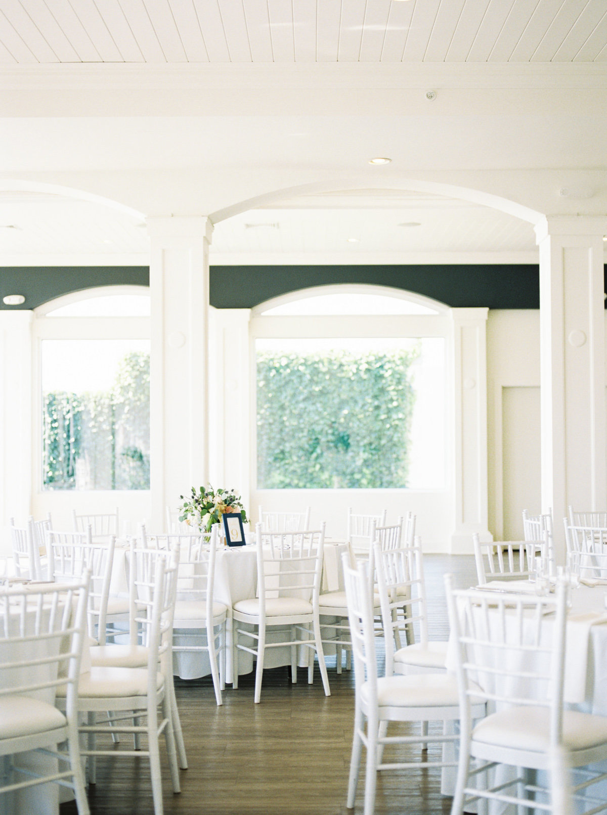 white chairs in luxury wedding venue belle mer