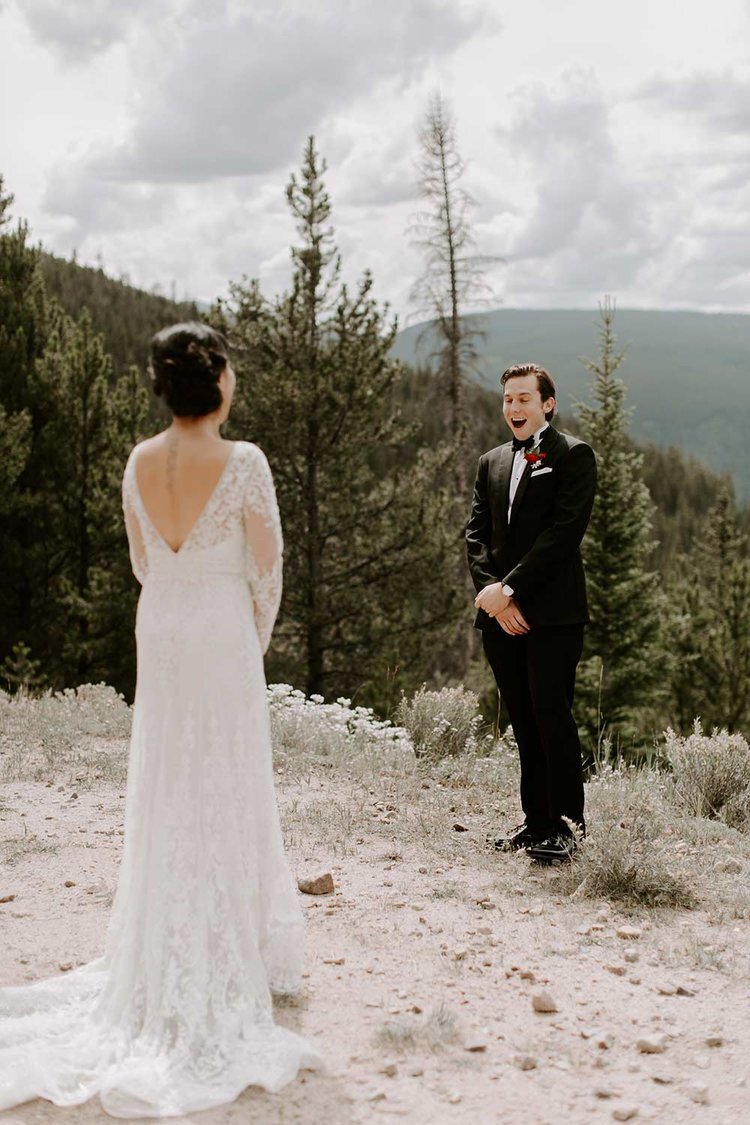 Bride and groom first look in the mountains