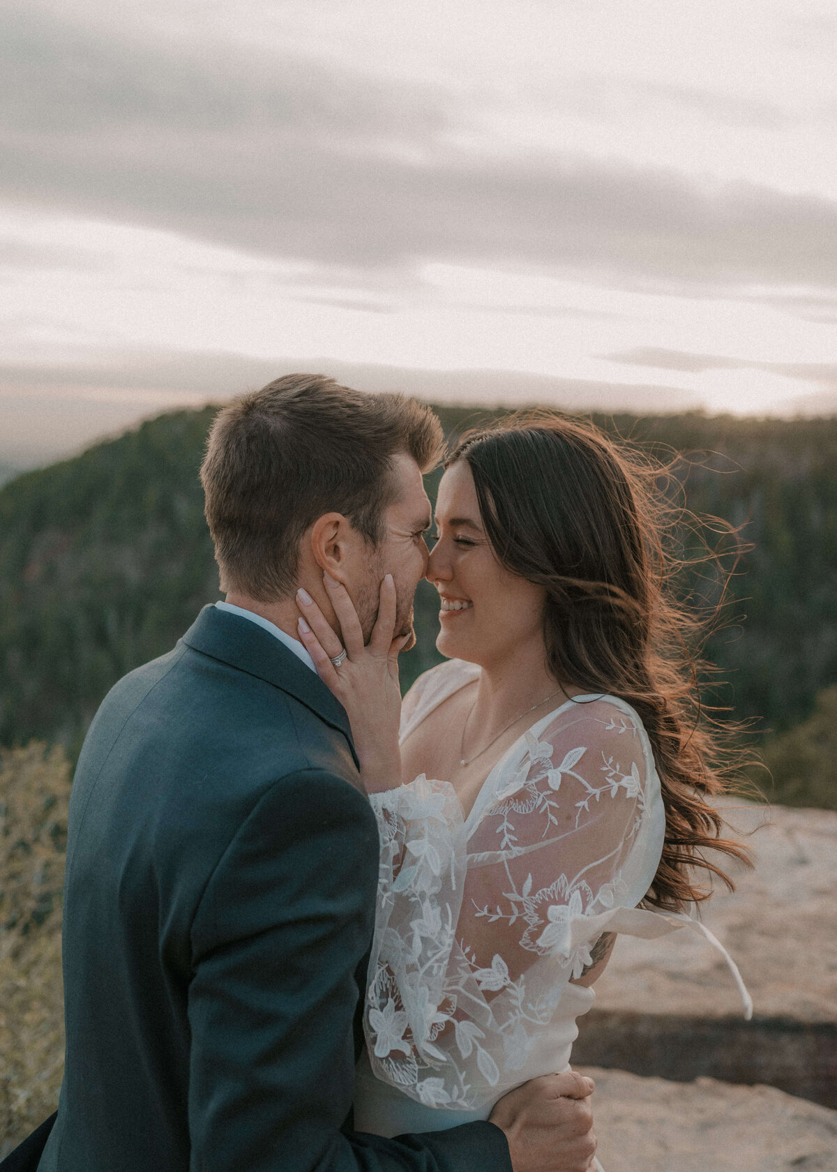 Bride and groom embracing during elopement on mogllon rim in payson, arizona