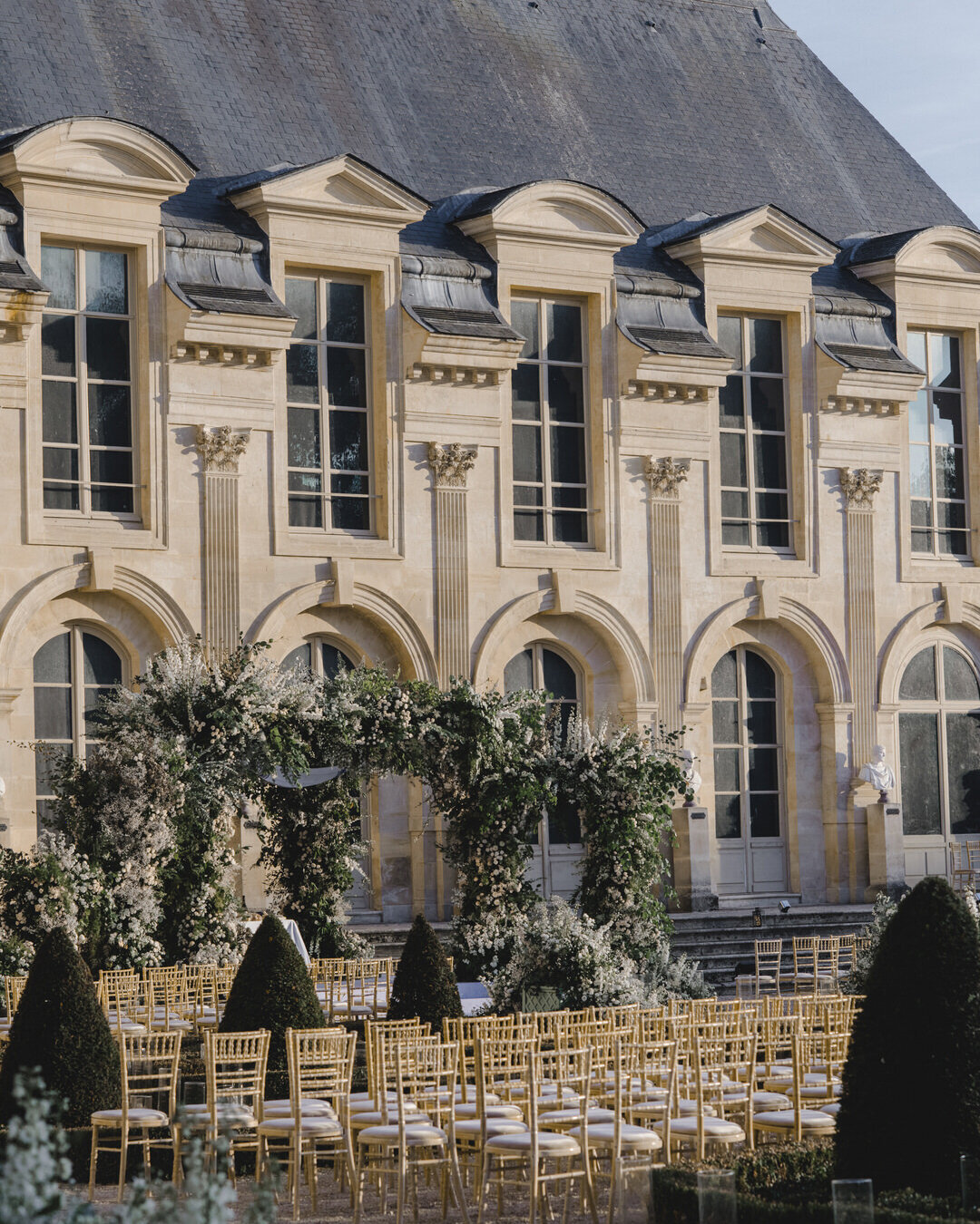 Paris Destination Wedding at Chateau de Chantilly by Alejandra Poupel Events arch and chateau de chantilly 
