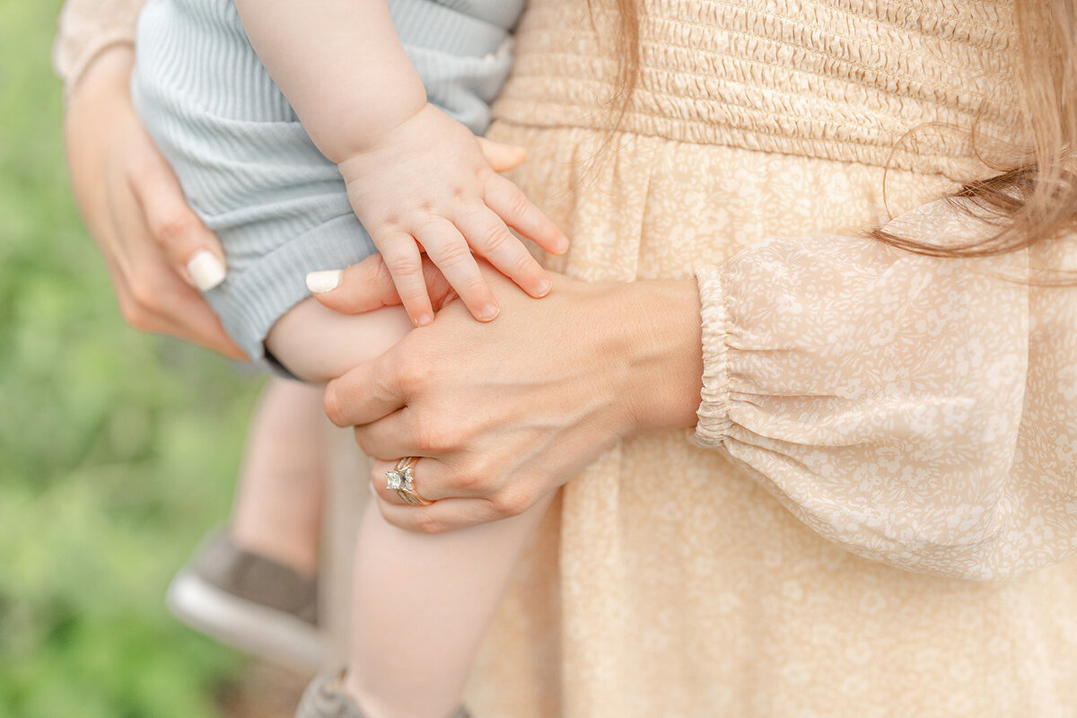 son holding mom’s hand during family session Marshall, Virginia