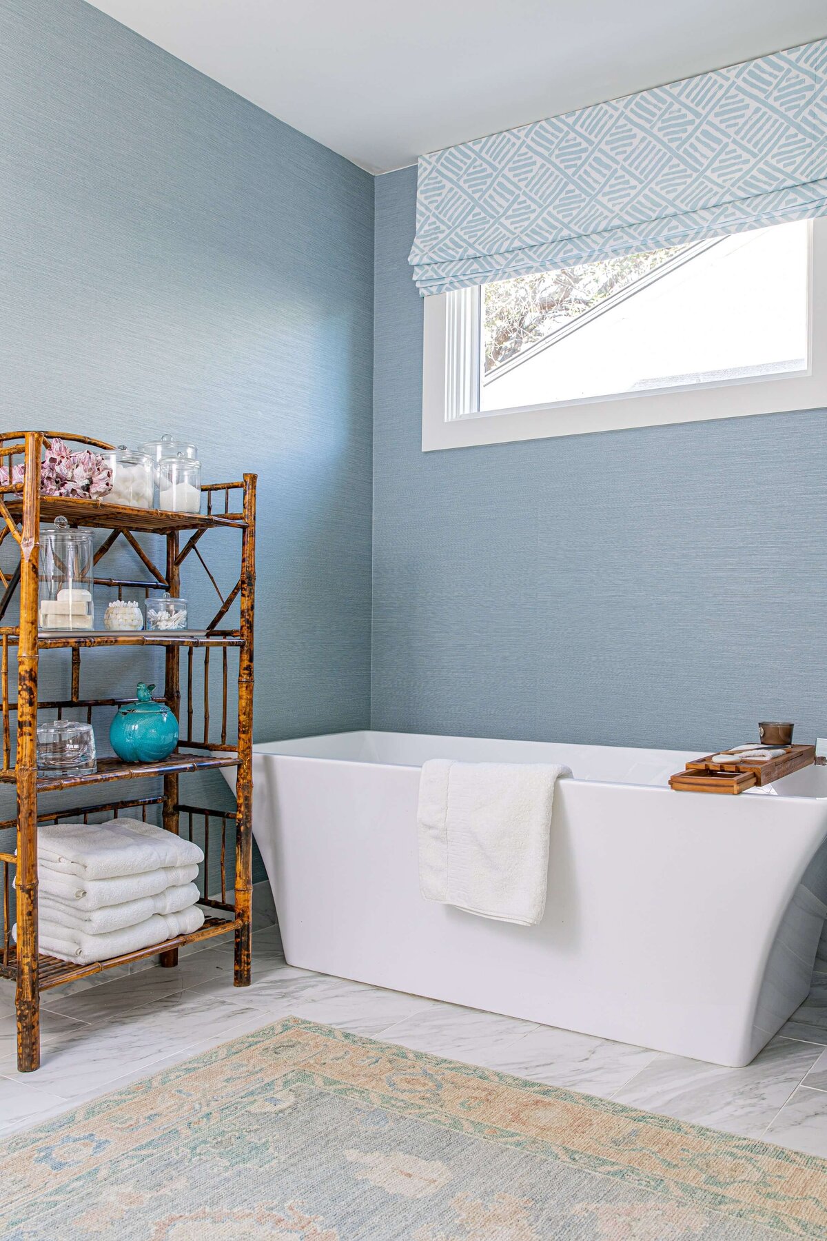 oyster creek studios highland park home bathroom with blue textured walls wooden shelving and free standing bathrub in bathroom