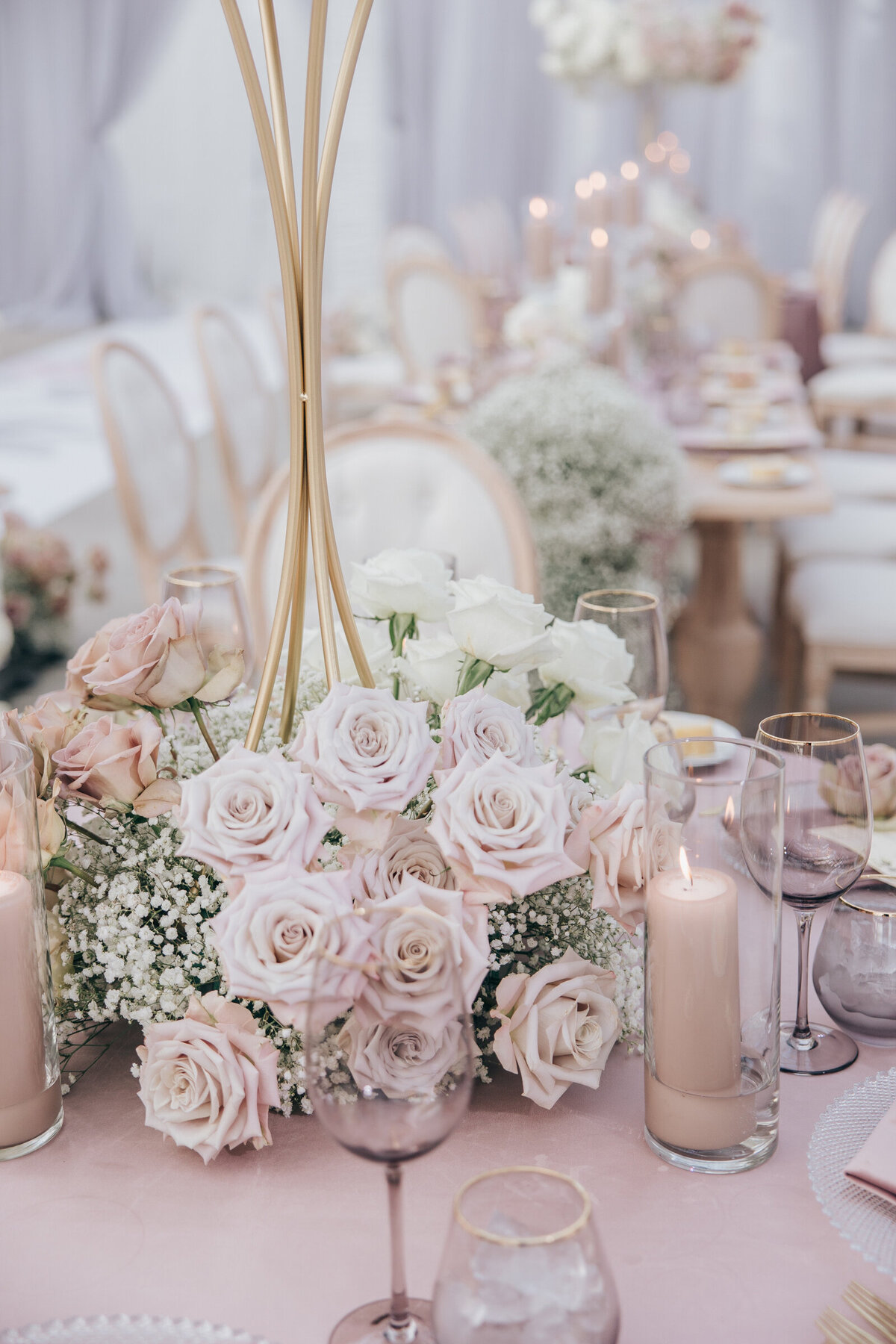 Glamorous wedding table florals and lavender glassware