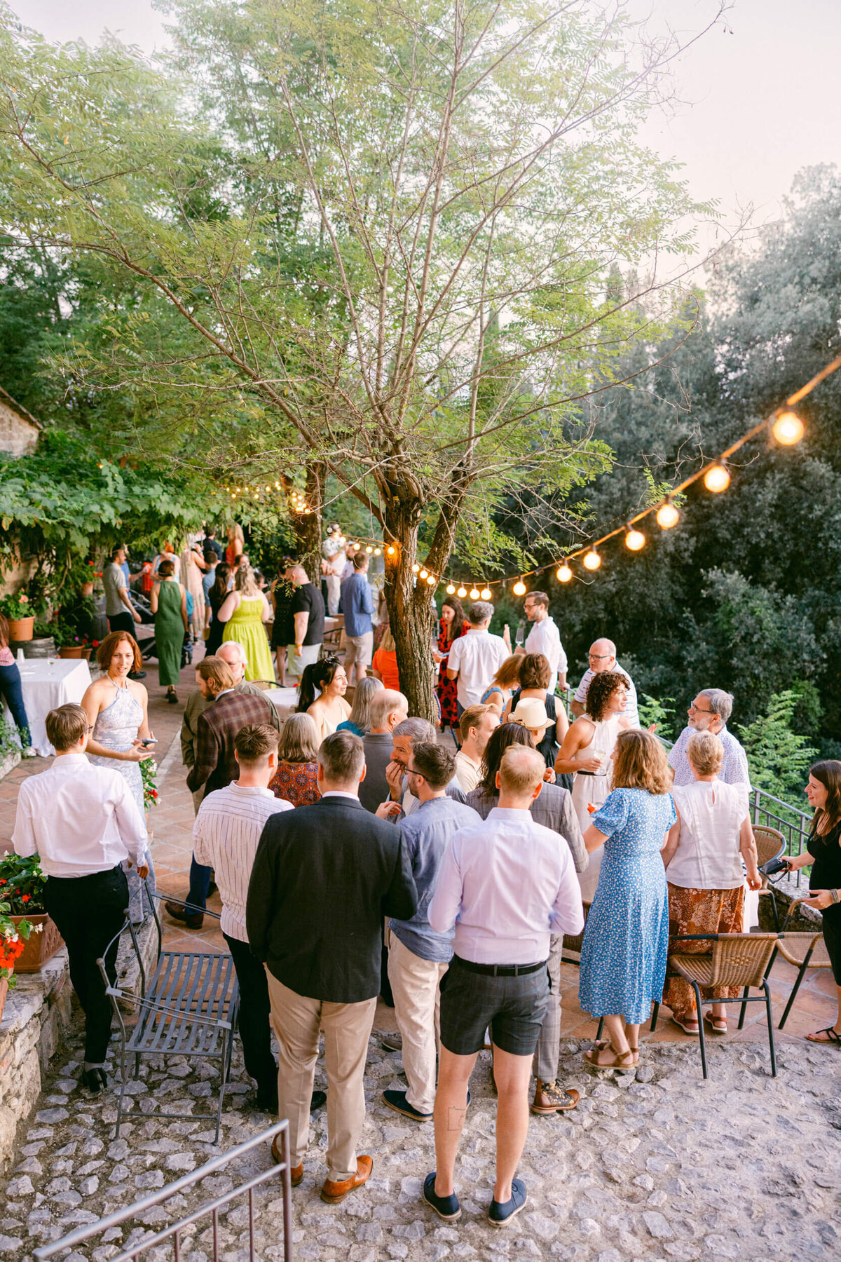 A wedding photo of the venue Laticastelli during cocktail hour in aTuscany Italy