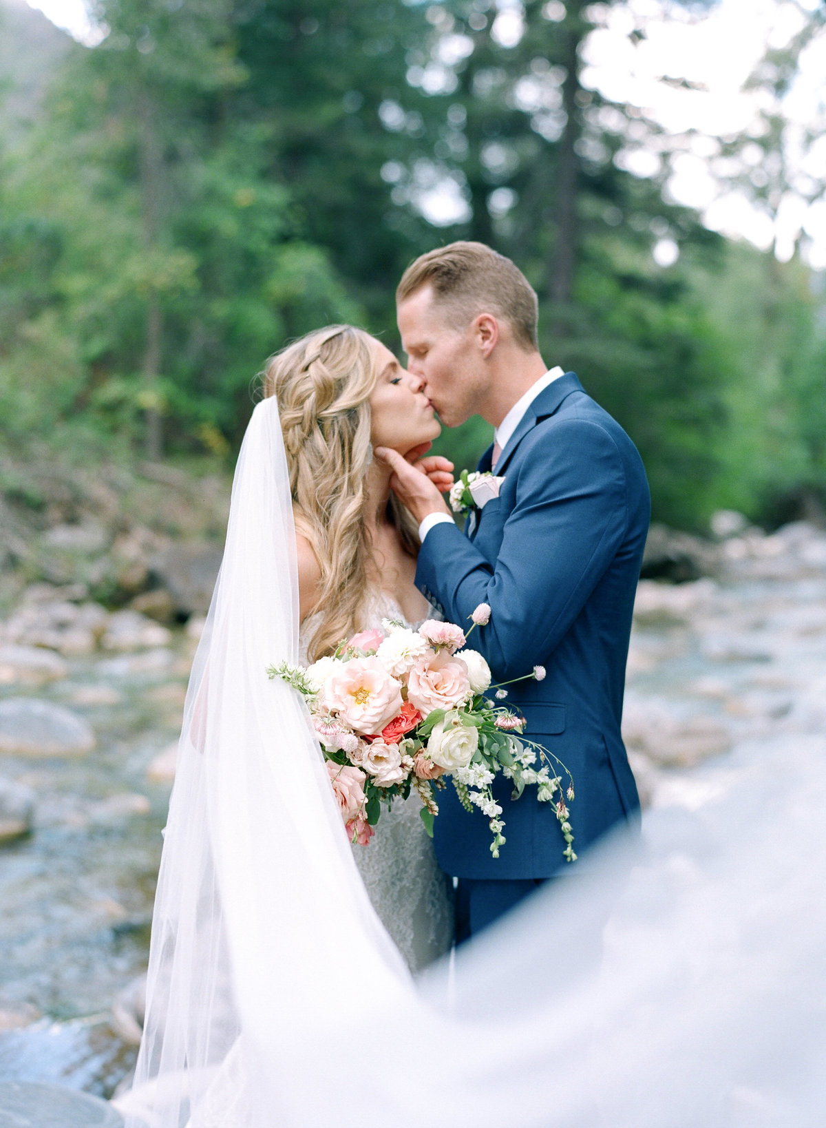 Aspen Wedding Photographer bride and groom on creek