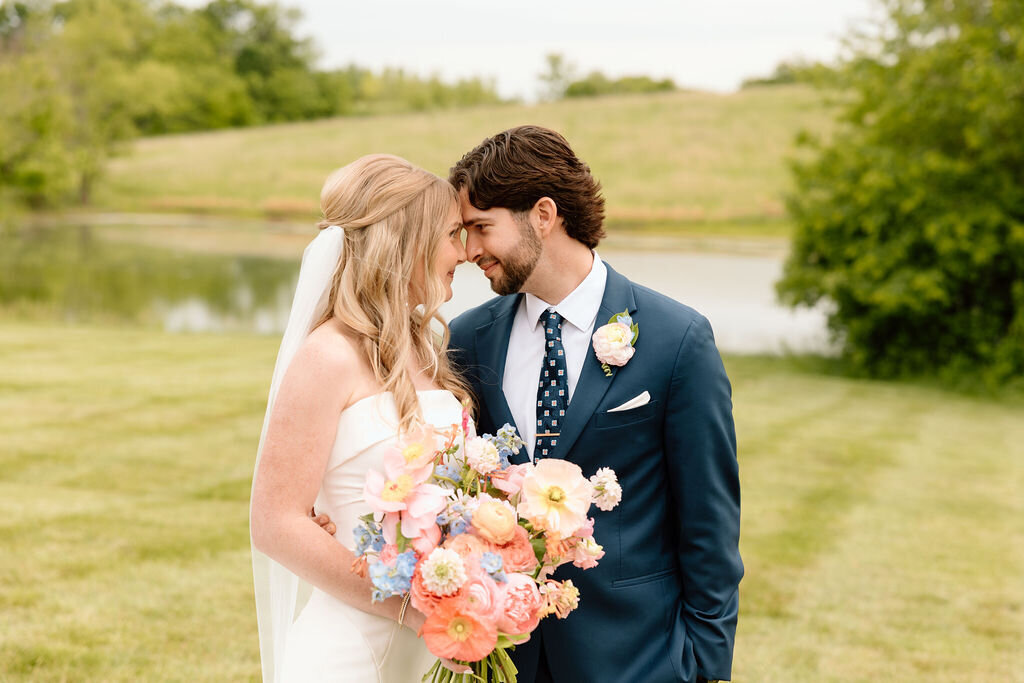 bride and groom embrace after wedding in kansas city missouri