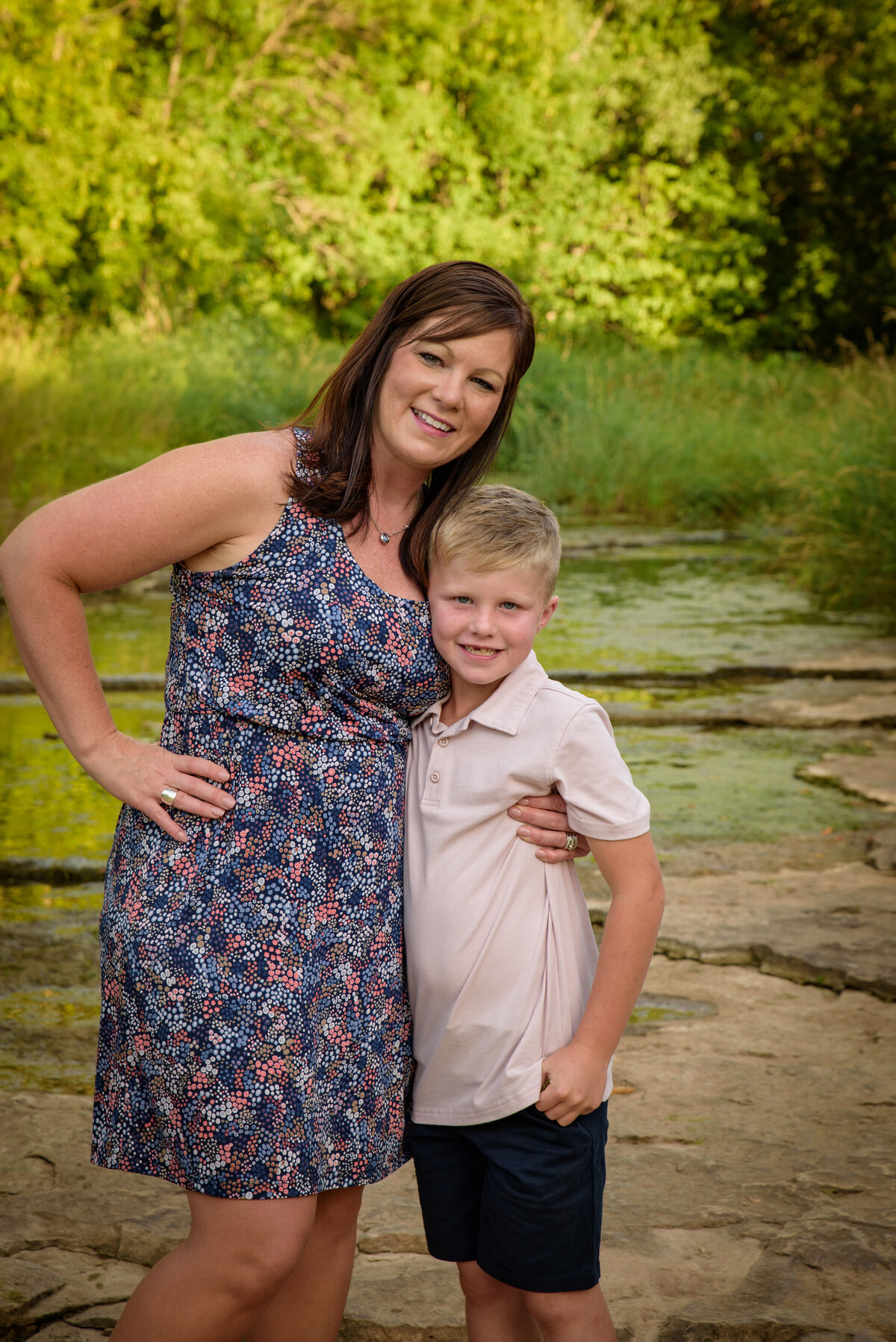 Mother and son portrait standing near creek at Fonferek Glen County Park near Green Bay, Wisconsin