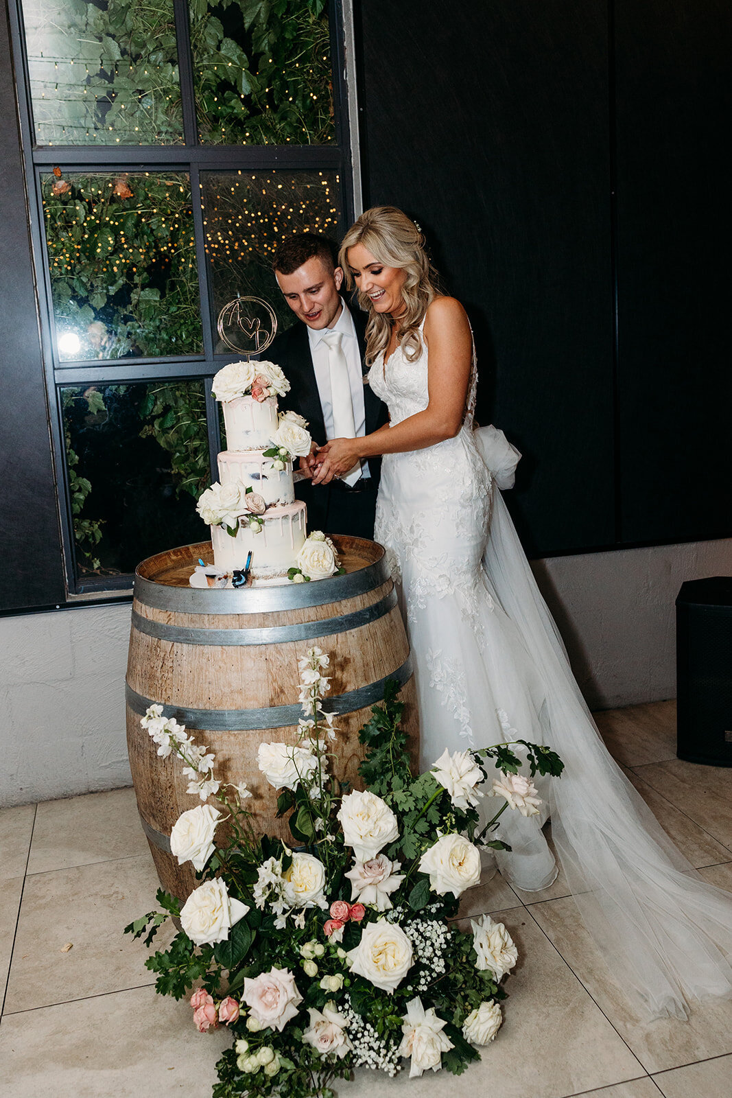 Groom and bride cut their wedding cake