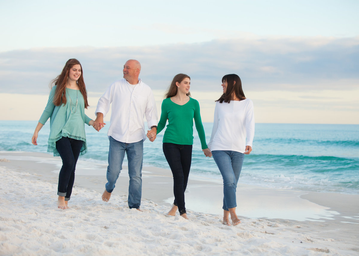 Adult family walking on the beach in Destin florida