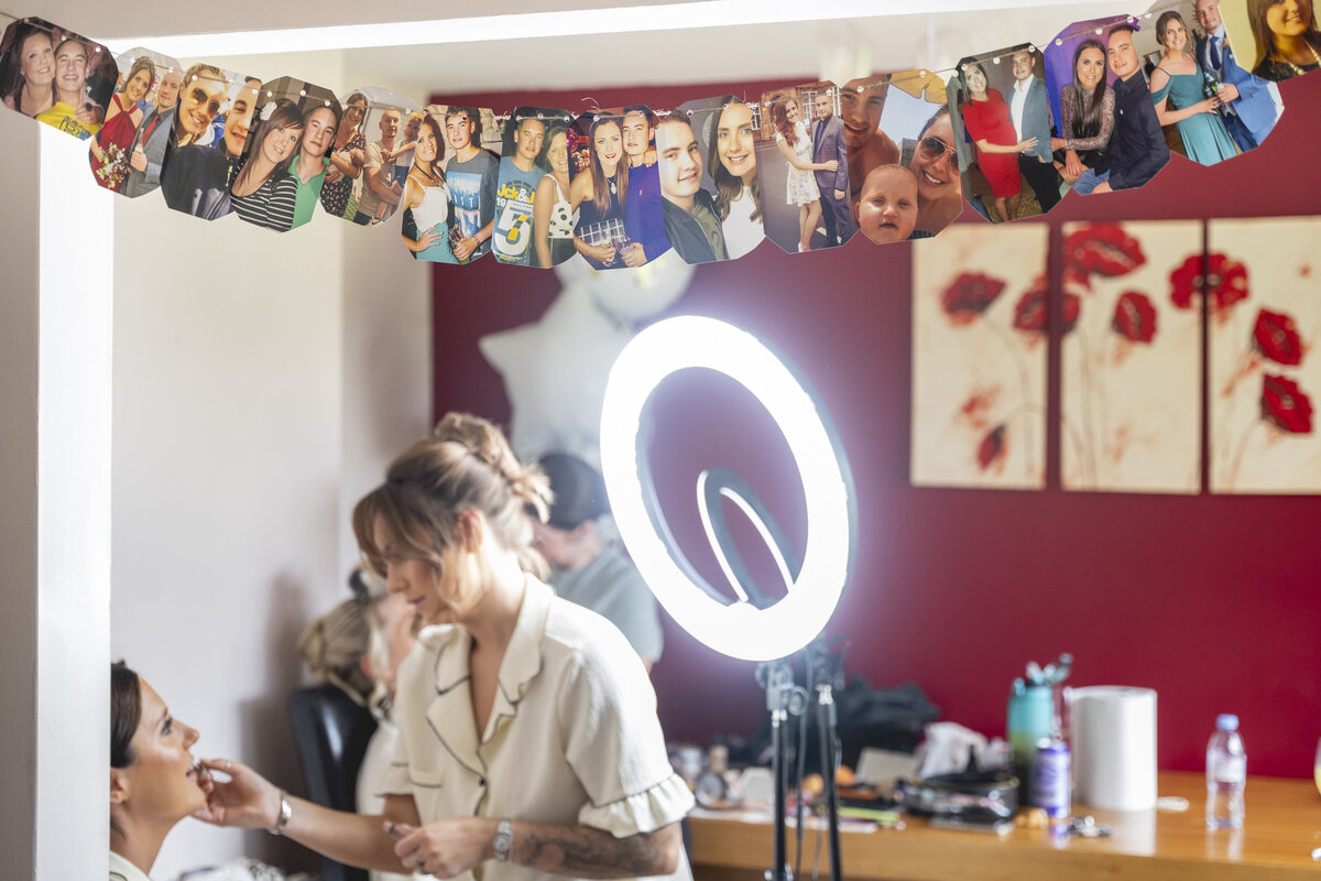 Amy having her makeup done