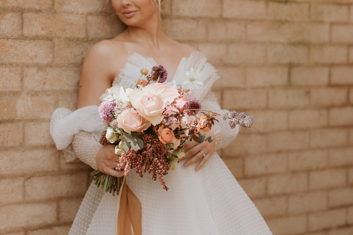 bride with beautiful wedding flowers