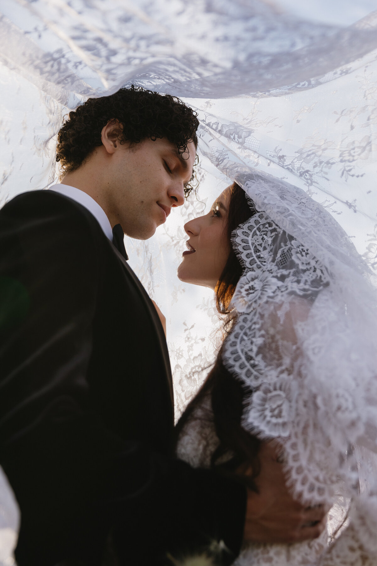 meredith-michel-editorial-wedding-under-lace-veil-cinematic-portrait