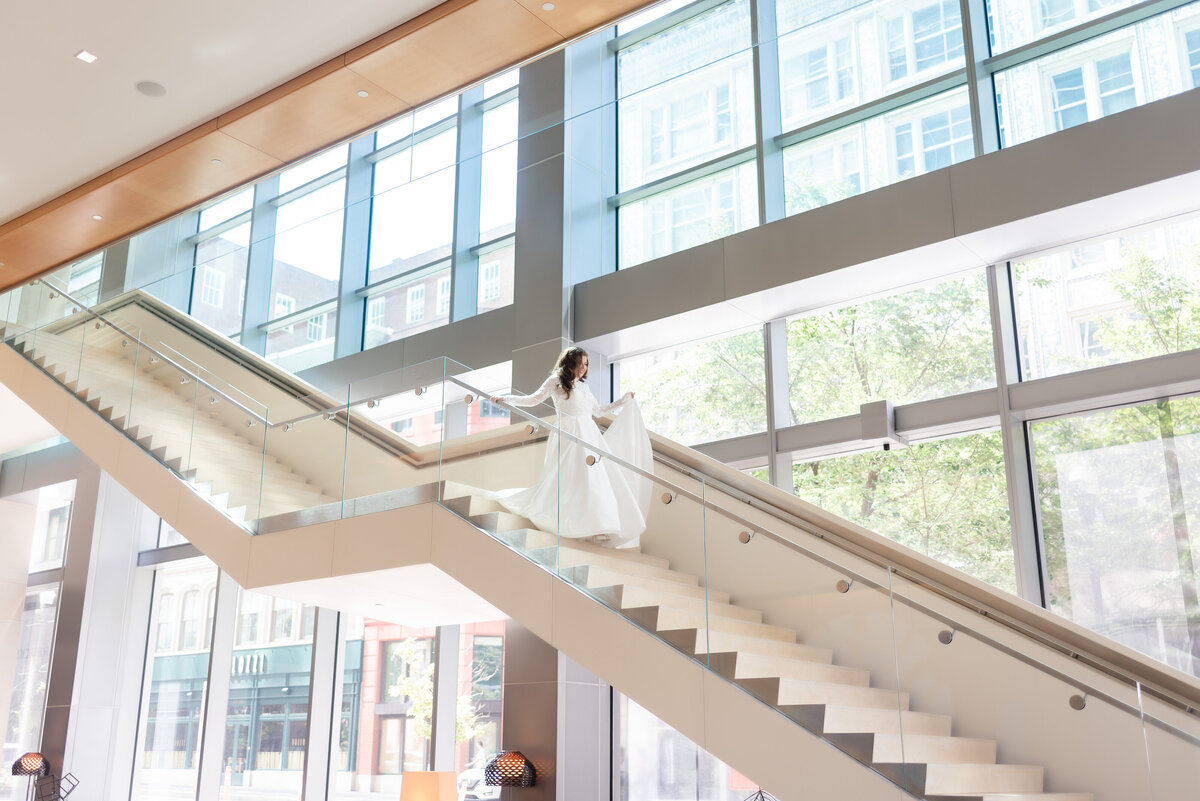 bride coming down stairs at fairmont hotel
