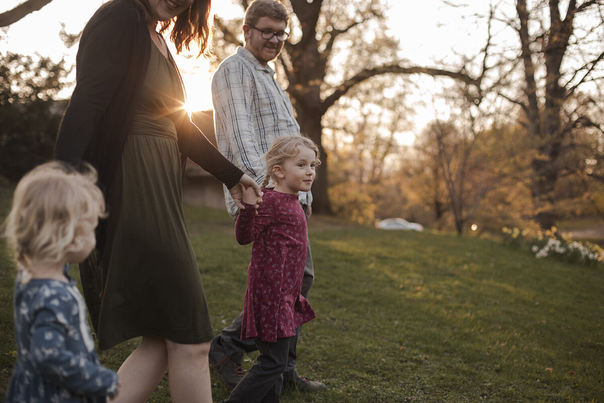 Family walking together at sunset, rochester ny family photographer