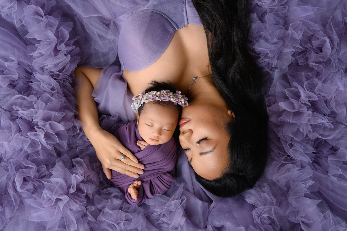 Creative newborn family posing at Wellington newborn photo studio.