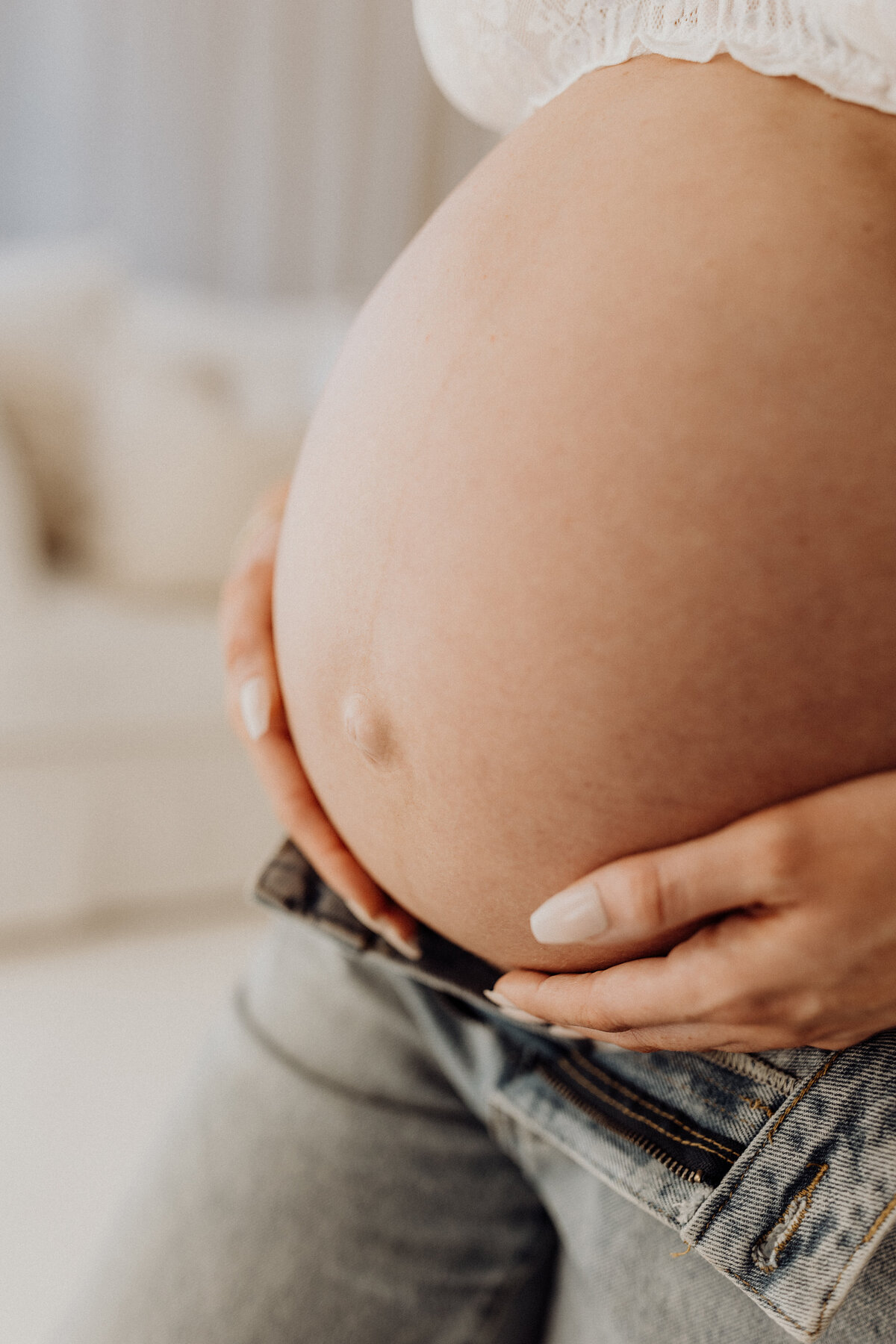 a close up of a pregnant belly