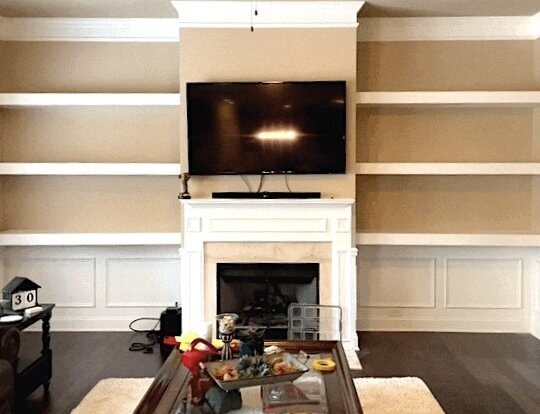 custom floating shelves built in living room