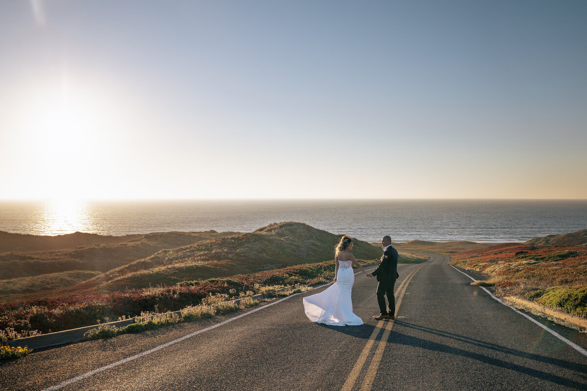 Bride and Groom hold hands in Pt Reyes