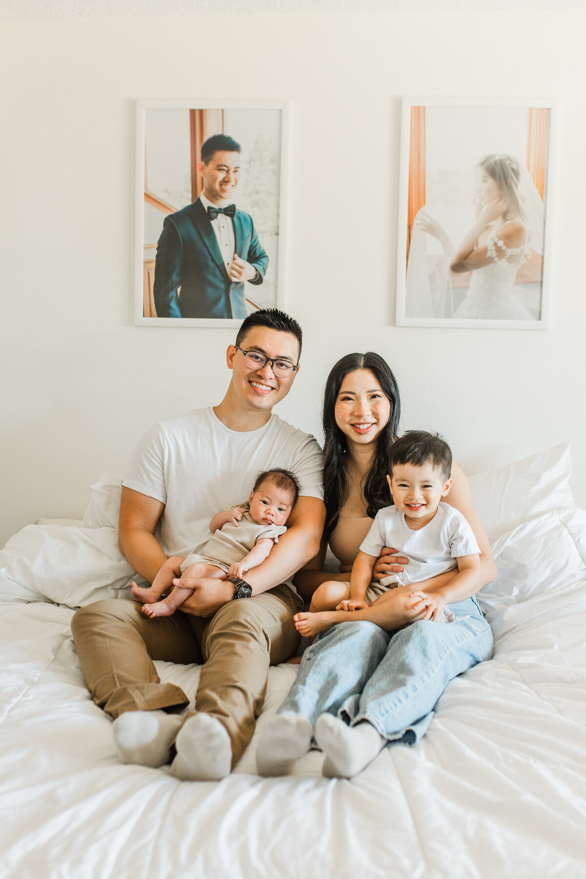 Mother holding his son and father holding the newborn