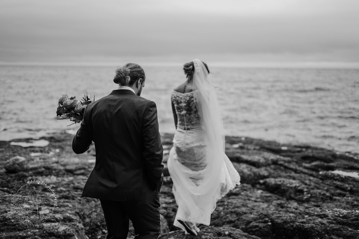 black and white photo of married couple walking