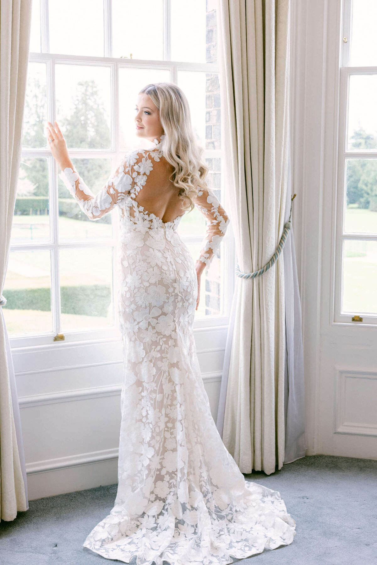 A wedding day photo of a bride in her white dress at Hedsor House in the UK