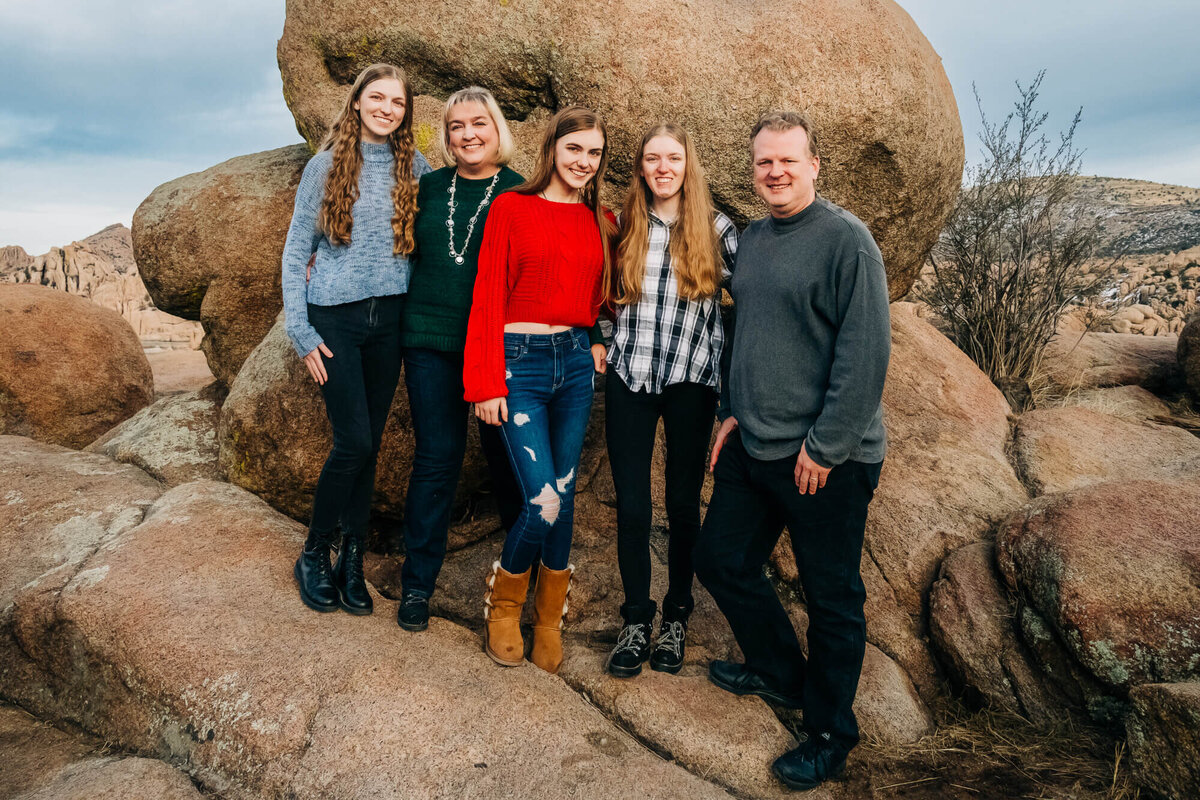 Family poses in Granite Dells for Prescott family photos with Melissa Byrne