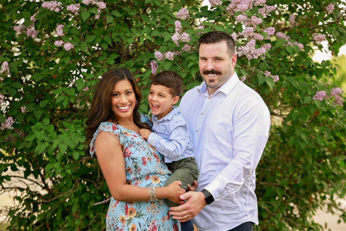 baby-boy-cuddling-in-parents-hands