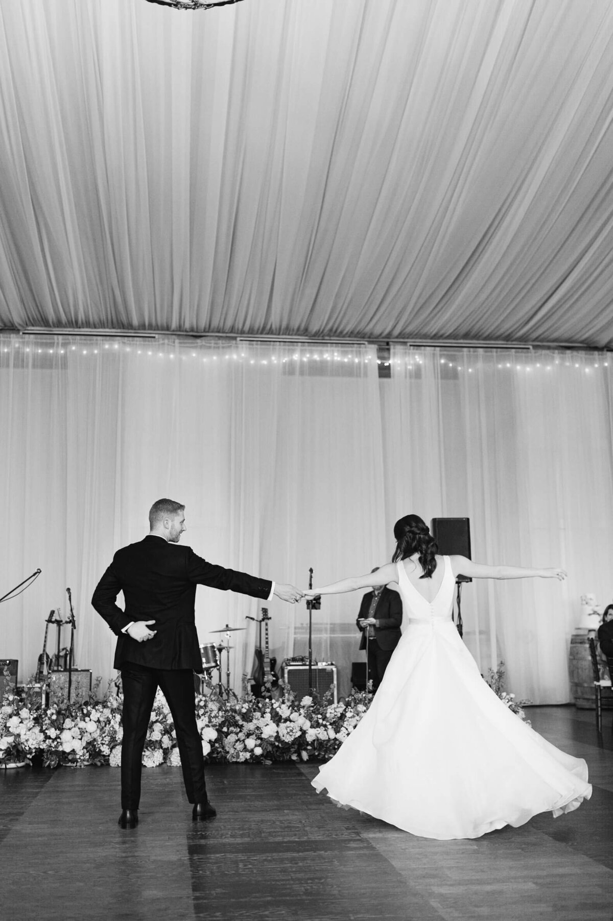 Bride and groom first dance twirl