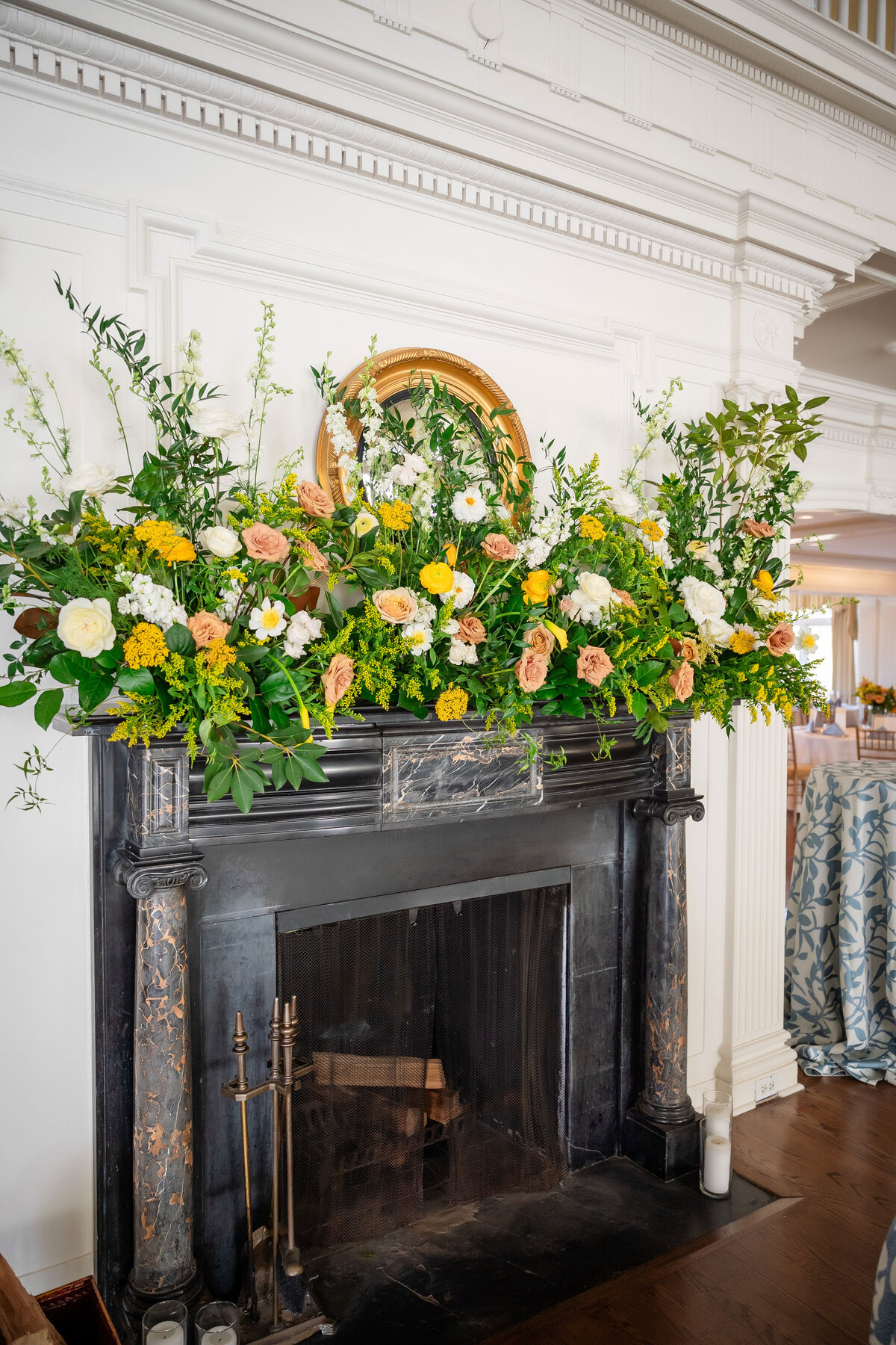 wedding flowers on fireplace at pittsburgh golf club
