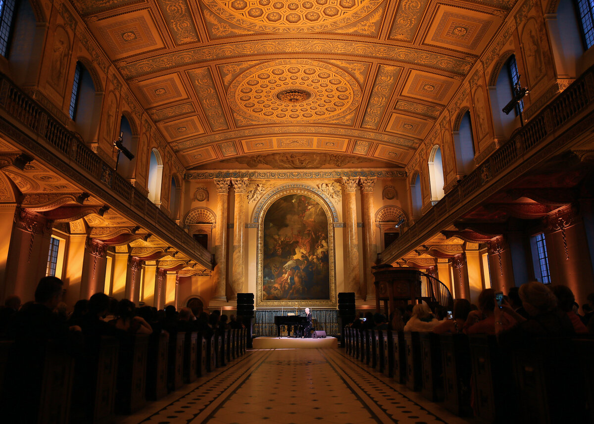 A celebrity performer playing at The Old Royal Naval College in London, planned by a luxury wedding planner london