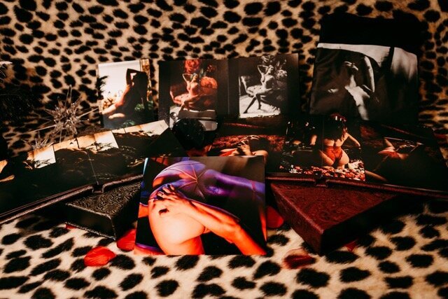 Boudoir photography three keepsake albums on leopard rug in Lubbock, Texas photographer in Amarillo TX