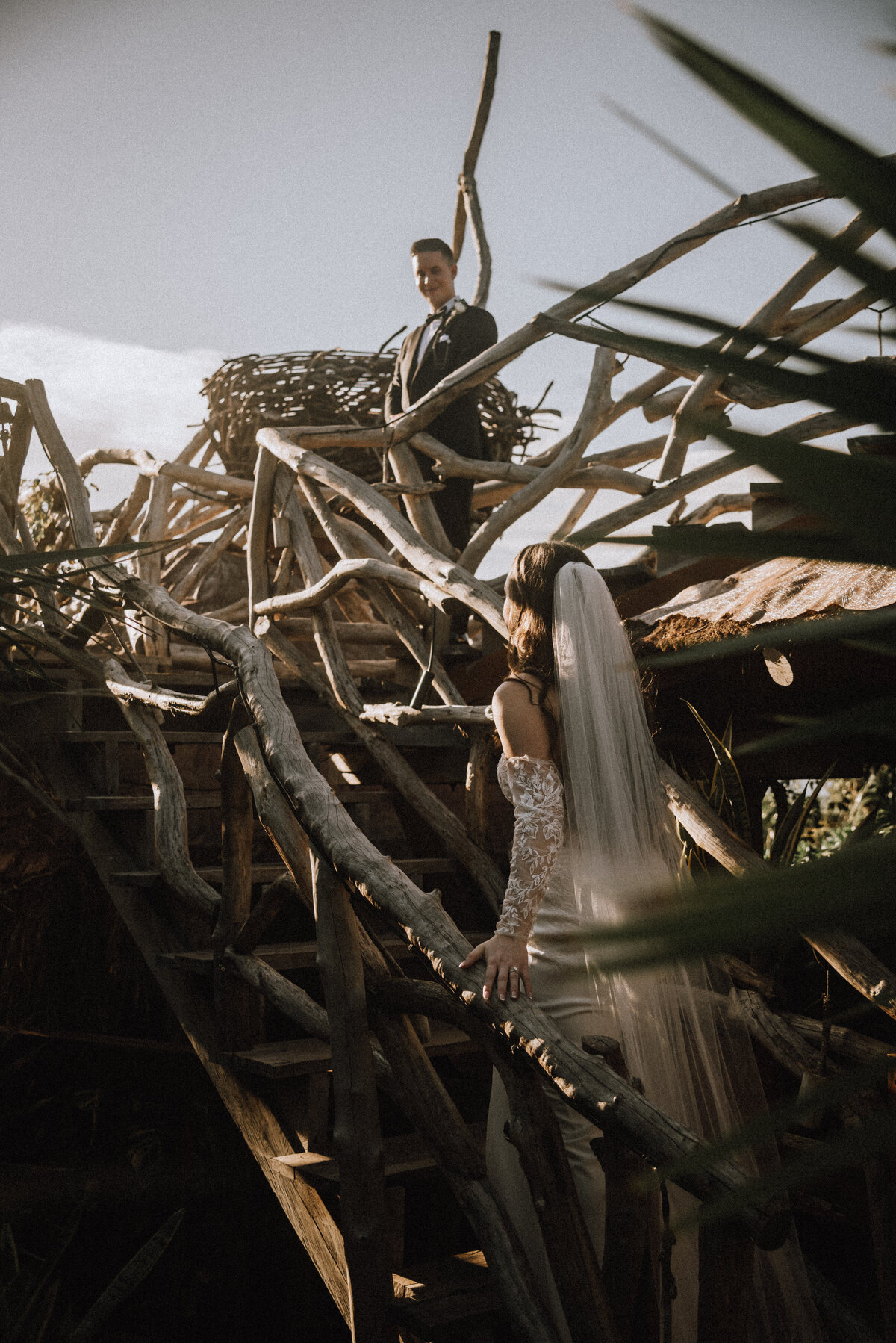 Bride walks up the stairs to meet her groom at their destination wedding in Kanan Tulum.  Photo by: Tulum Wedding Photos