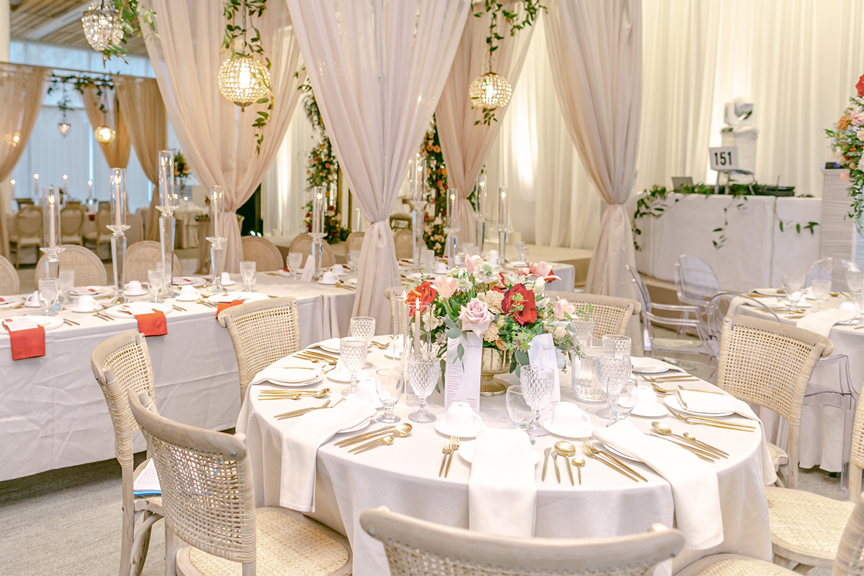 kavita-mohan-ivory-gold-orange-greenery-wedding-reception-centerpieces-napkins-candles-chandeliers