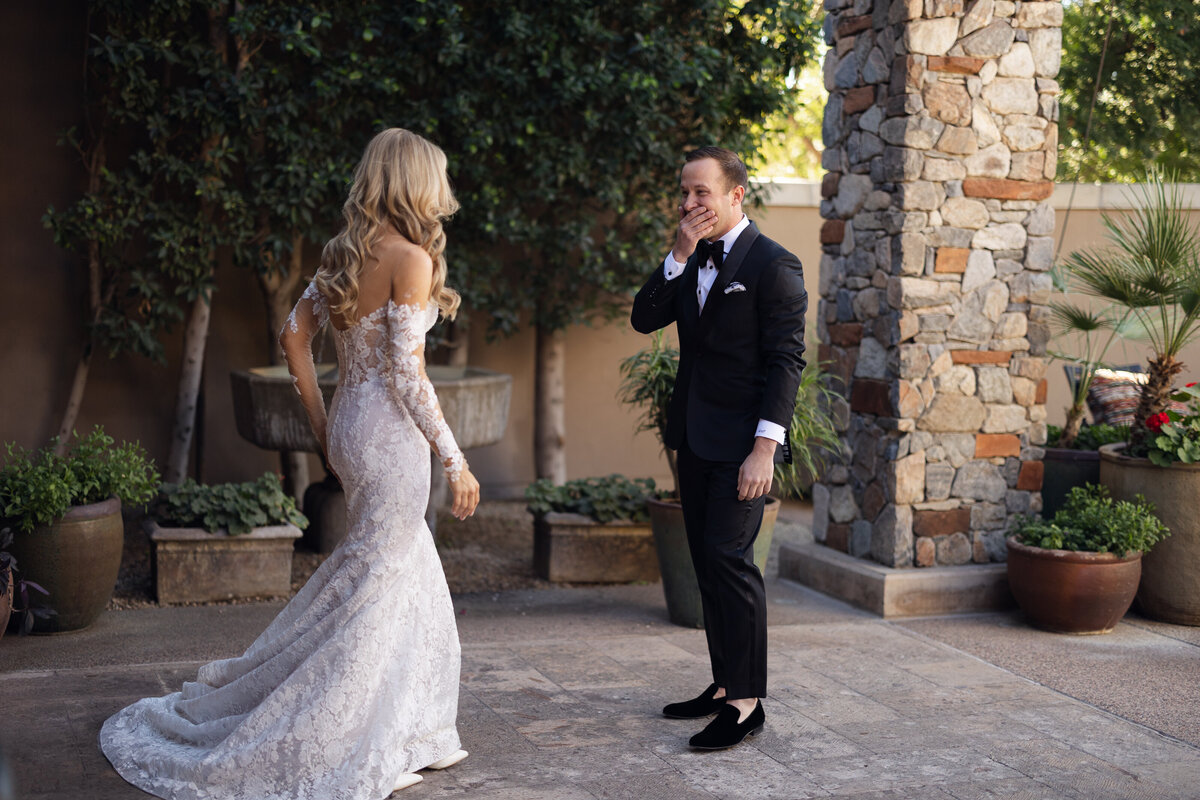 Bride and groom exchanging first look on wedding day at Paradise Valley Country Club