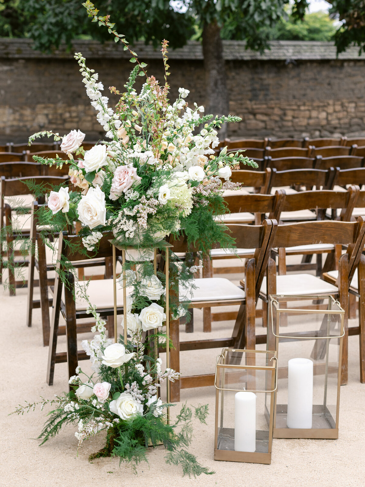 Ceremony aisle candles and arrangement | Bella Fleur
