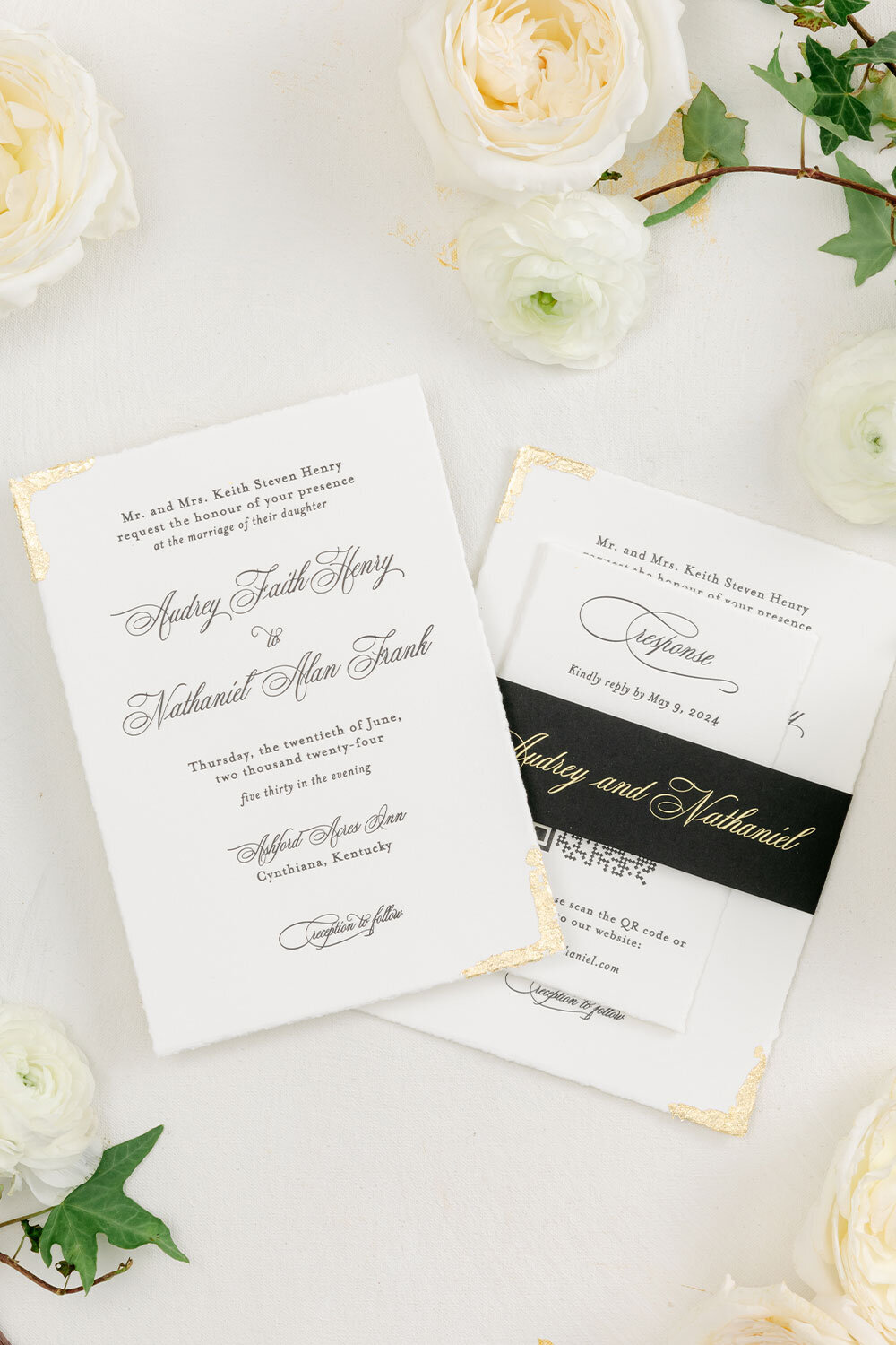 Black letterpress wedding invitations with gold foil edging, with hand-torn paper and a coordinating black belly band with gold foil script.