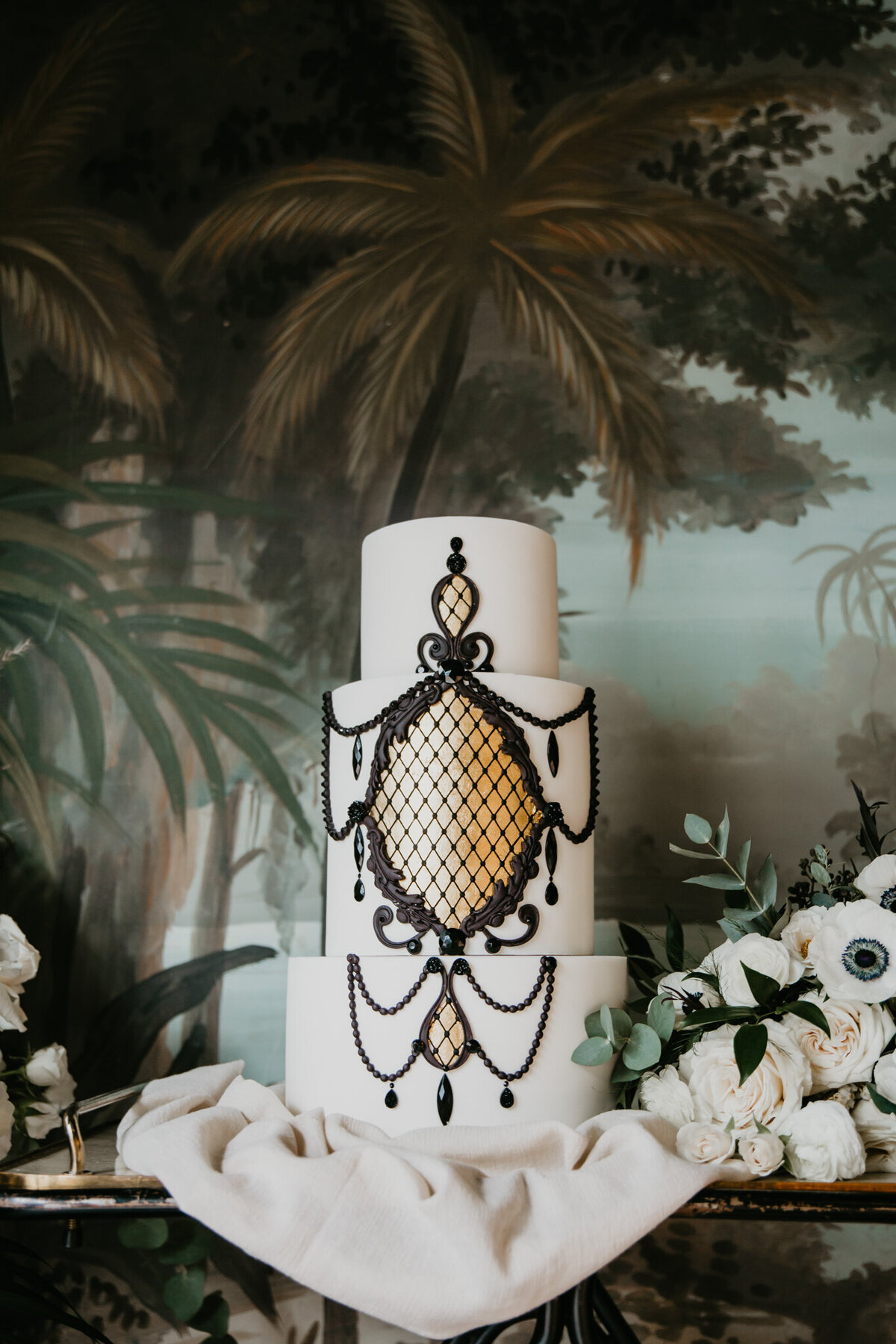 Elegant and ornate wedding cake captured by Nikki Collette Photography, adventurous and romantic wedding photographer in Red Deer, Alberta. Featured on the Bronte Bride Vendor Guide.