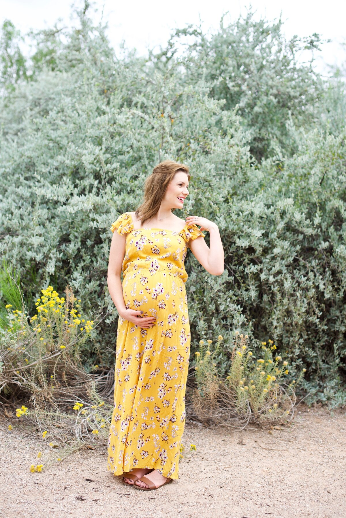 maternity session in a yellow dress