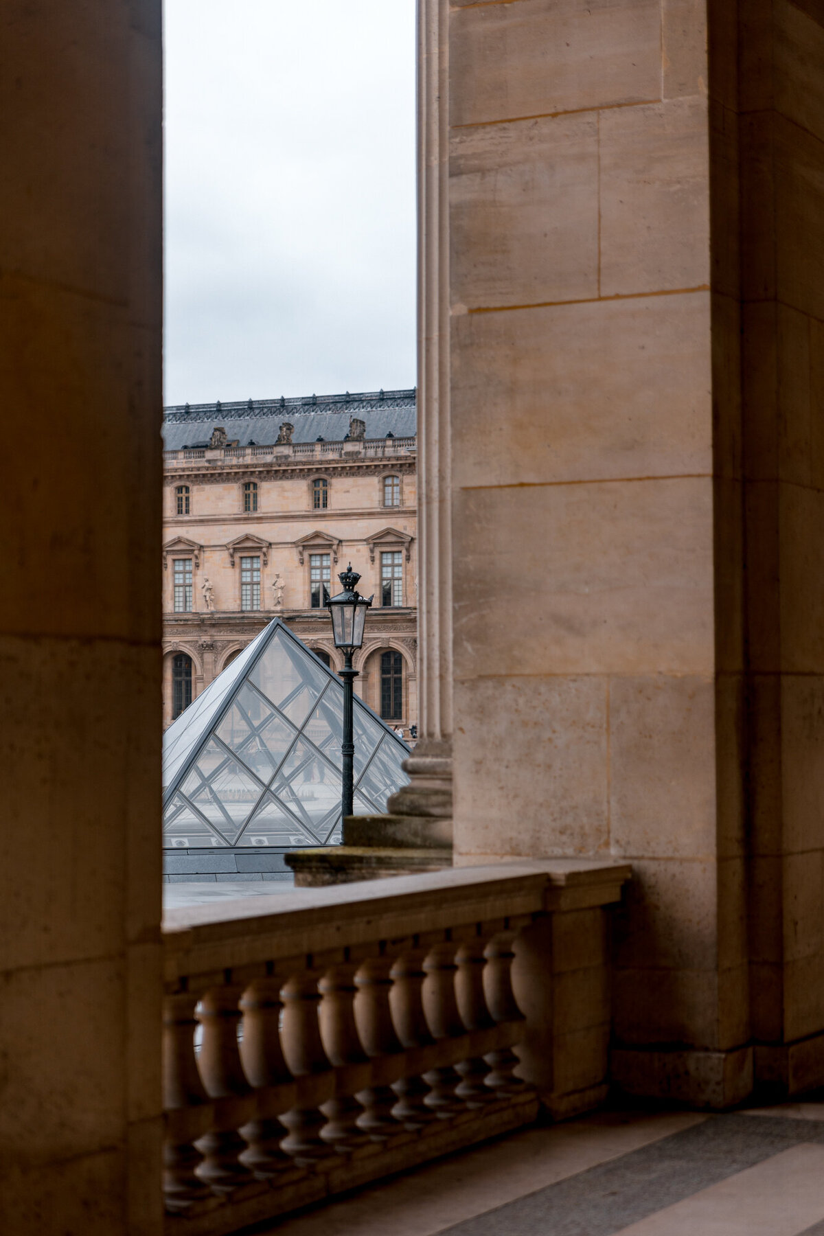 The Louvre Museum peeking through columns