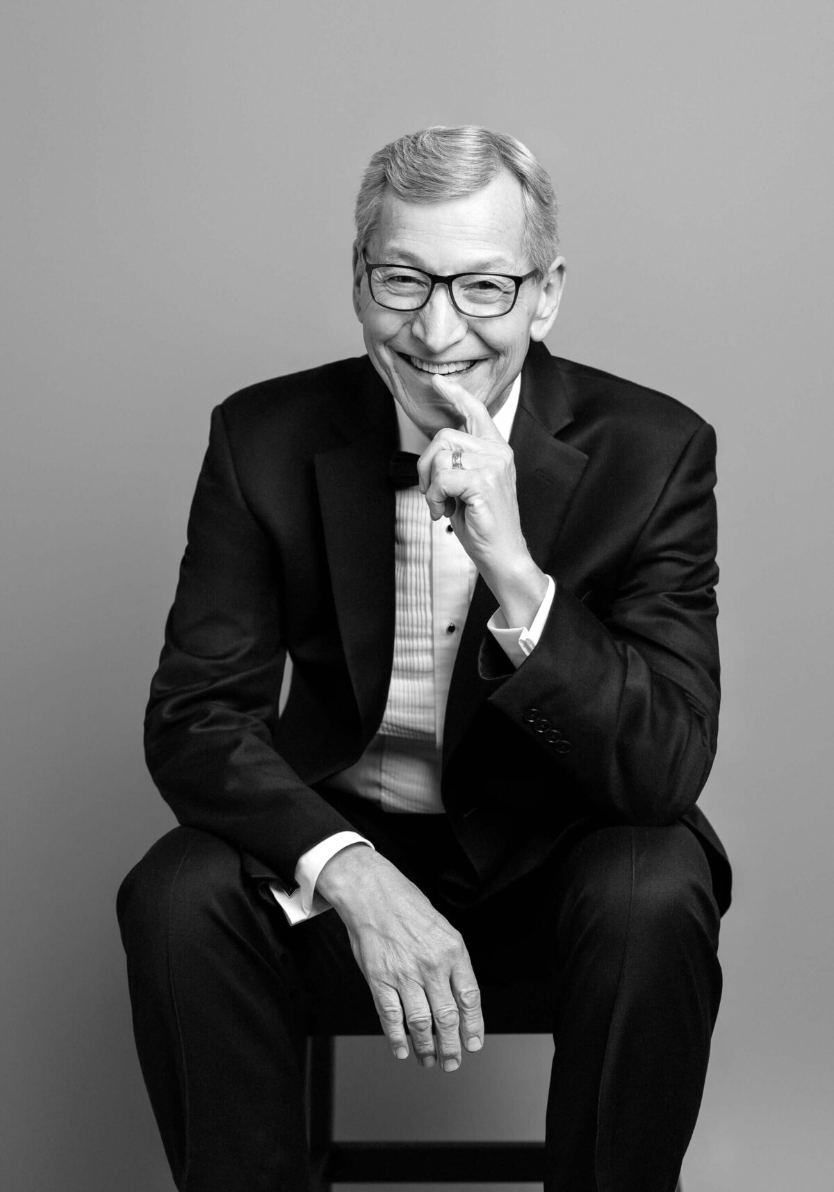 Smiling elderly gentleman in a tuxedo.