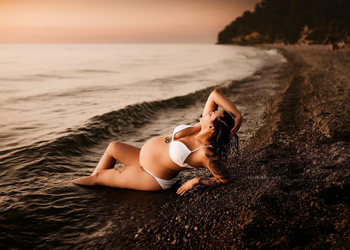bathing suit maternity photo on rocks