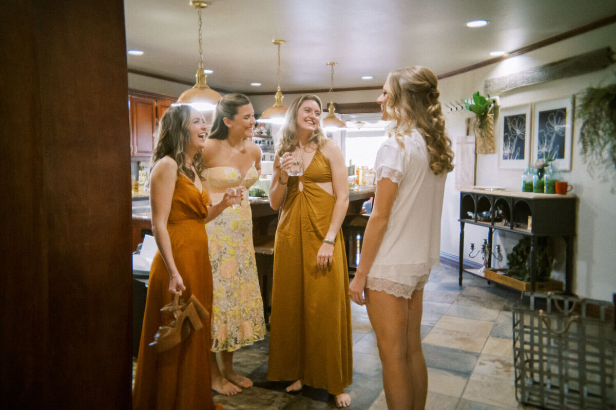 women-standing-in-kitchen-laughing