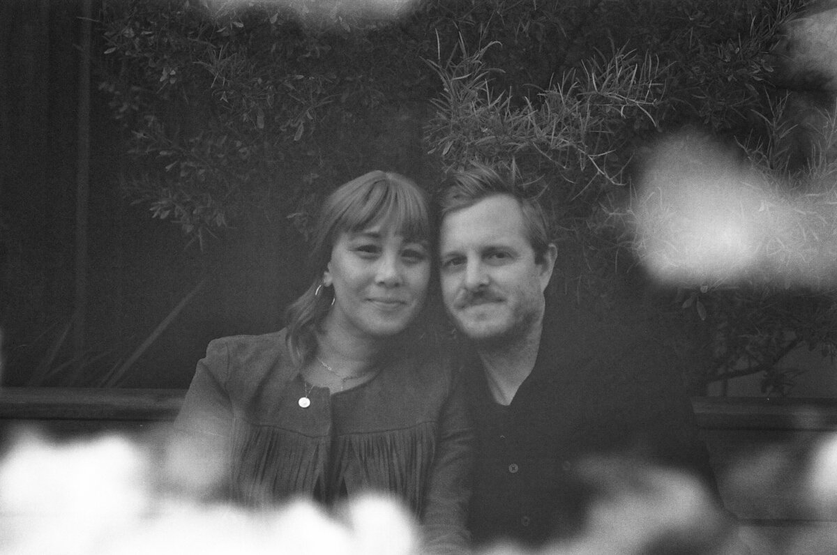 Film portrait of couple in their backyard