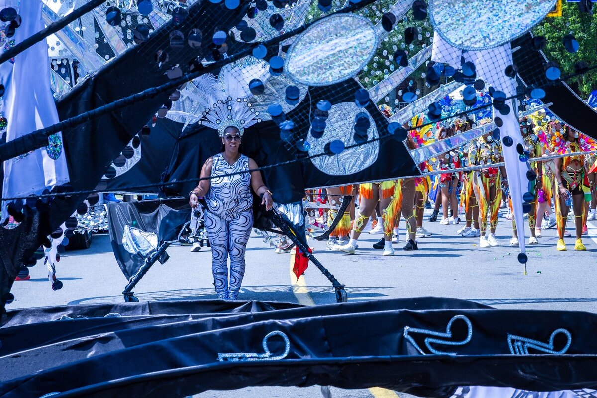 Toronto caribbean carnival parade masqueraders having fun in costume with Sunlime Mas, the number 1 medium size band at Toronto Carnival.